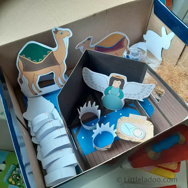 Paper nativity set packed in a cardboard box